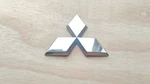 03-06 Mitsubishi Outlander Rear Trunk Emblem Badge MR511958. Fixed Price $5.00.