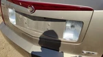 03-07 Cts License Plate Trim Surround Panel Oem Tail Trunk Finish Sand Storm 61U. Fixed Price $450.00.