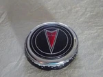 89 90 91 Pontiac 6000 Diecast Trunk Lock Cover Chrome, Black Red Arrow. Fixed Price $25.00.