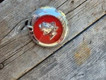 1949 Mercury Chrome / Red Trunk Lock Cover. 8M-704351.. Fixed Price $60.00.